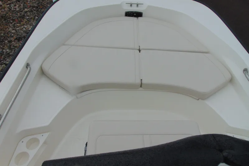 Slide: The Image of 2026 Boston Whaler 170 Montauk boat interior with cushioned seating and storage compartments. - 9
