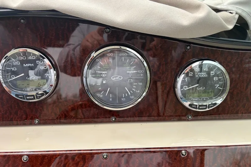 Slide: The Image of Dashboard gauges of a 2008 Sea Ray Sundancer 310 boat. - 11