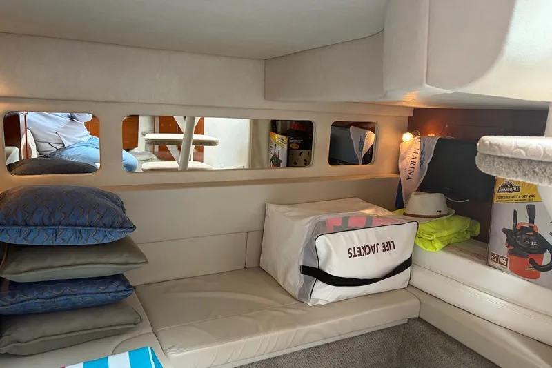 Slide: The Image of Interior cabin of 2008 Sea Ray Sundancer 310 with cushions and life jackets. - 19