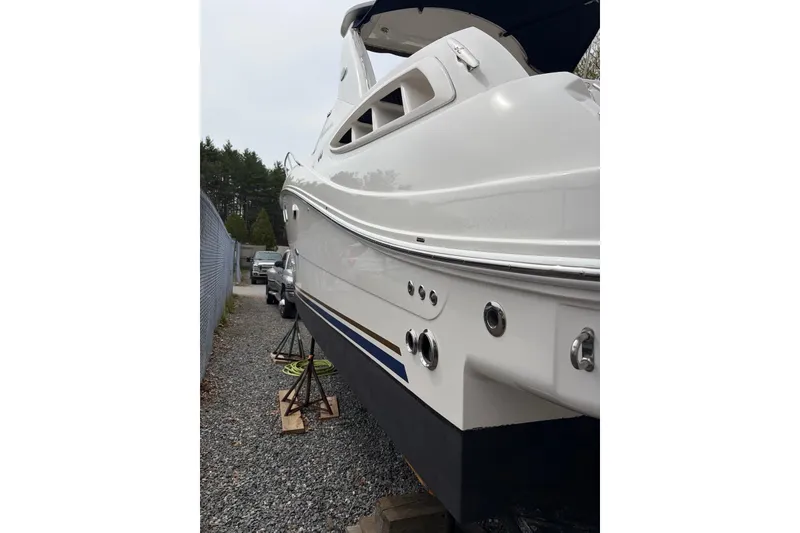 Slide: The Image of 2008 Sea Ray Sundancer 310 boat on stands, side view, outdoors. - 26