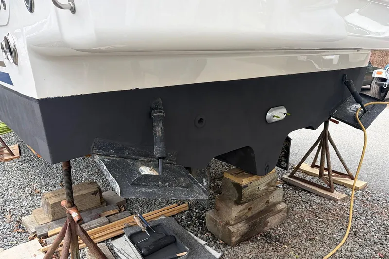 Slide: The Image of 2008 Sea Ray Sundancer 310 boat hull on stands, undergoing maintenance. - 27