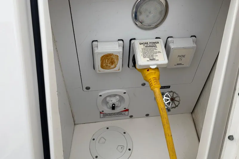 Slide: The Image of Electrical panel of 2008 Sea Ray Sundancer 310 with shore power connection. - 34