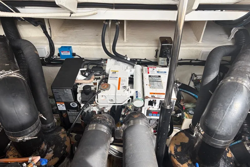 Slide: The Image of Engine compartment of a 2008 Sea Ray Sundancer 310 boat, featuring Kohler generator. - 36