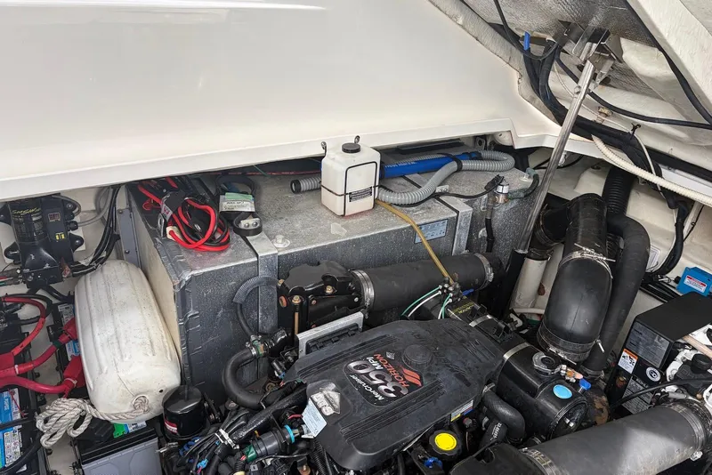 Slide: The Image of Engine compartment of a 2008 Sea Ray Sundancer 310 boat, showcasing mechanical components. - 38