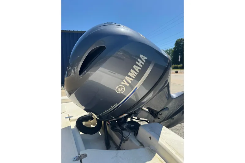 Slide: The Image of Yamaha outboard motor on a 2015 Scout 177 Sport boat, sunny day background. - 10