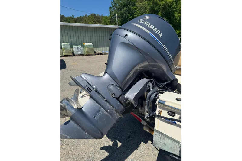 Slide: The Image of Yamaha outboard motor on 2015 Scout 177 Sport boat, parked outdoors. - 11