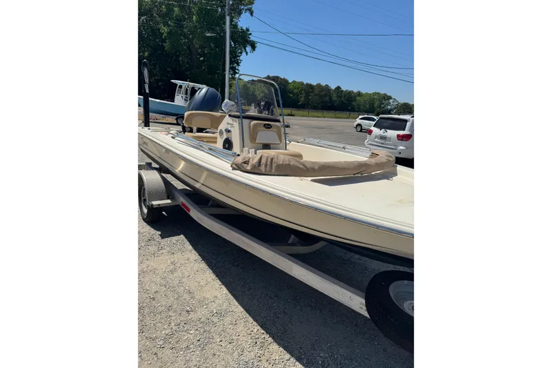 Slide: The Image of 2015 Scout 177 Sport boat on trailer in outdoor setting. - 13