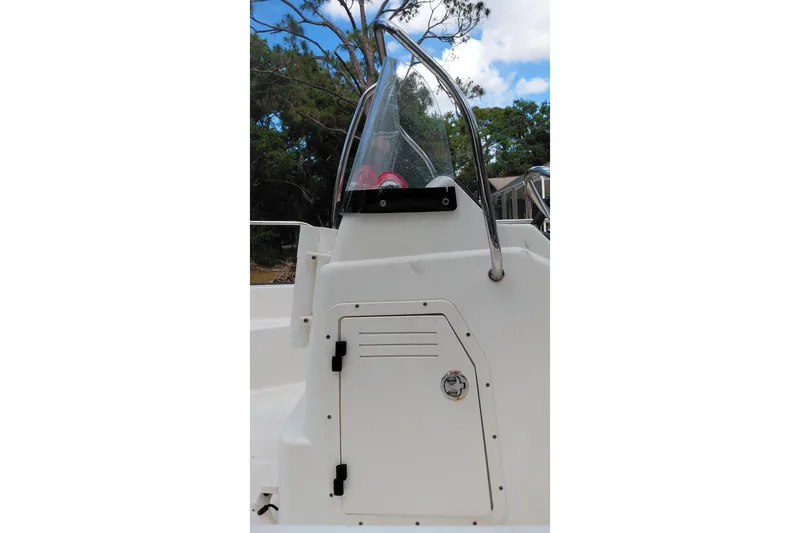 Slide: The Image of 2005 Boston Whaler 170 Montauk boat console with windshield and storage compartment. - 10