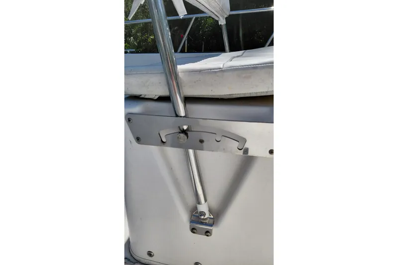 Slide: The Image of Close-up of a 2005 Boston Whaler 170 Montauk boat's metal railing and seat. - 13