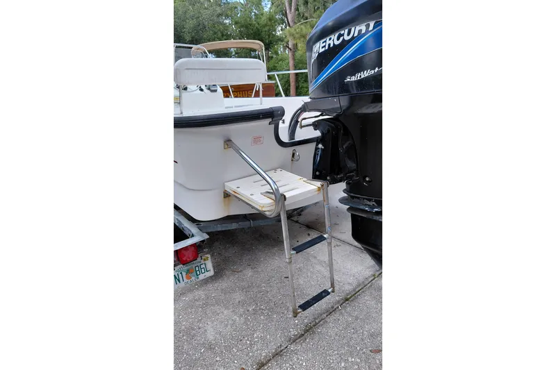 Slide: The Image of 2005 Boston Whaler 170 Montauk boat with Mercury engine and boarding ladder. - 15