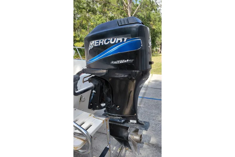 Slide: The Image of Mercury outboard motor on a 2005 Boston Whaler 170 Montauk boat. - 17