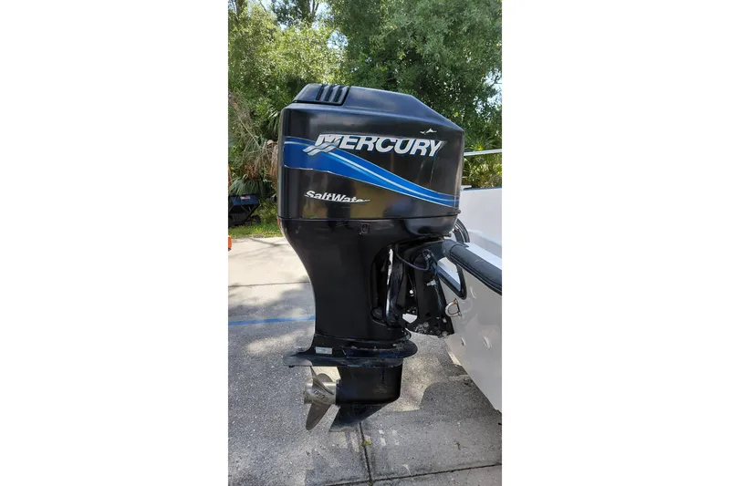Slide: The Image of Mercury Saltwater outboard motor on a 2005 Boston Whaler 170 Montauk boat. - 18