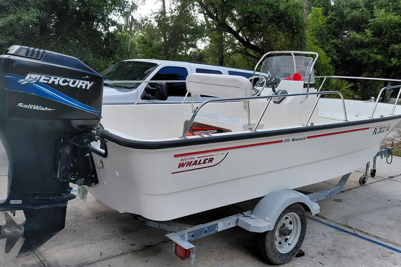 Slide: The Image of 2005 Boston Whaler 170 Montauk boat with Mercury SaltWater engine on trailer. - 3
