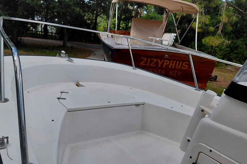 Slide: The Image of 2005 Boston Whaler 170 Montauk boat interior with another boat named Zizyphus in the background. - 5