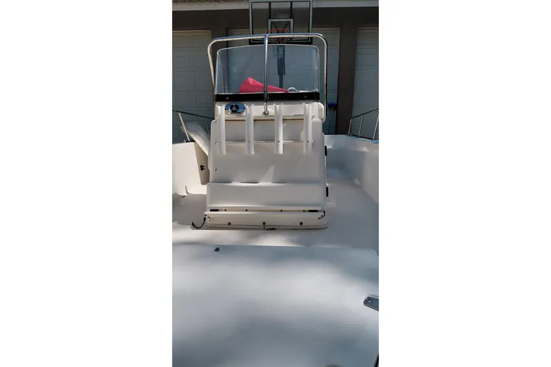 Slide: The Image of 2005 Boston Whaler 170 Montauk boat interior with console and seating. - 6