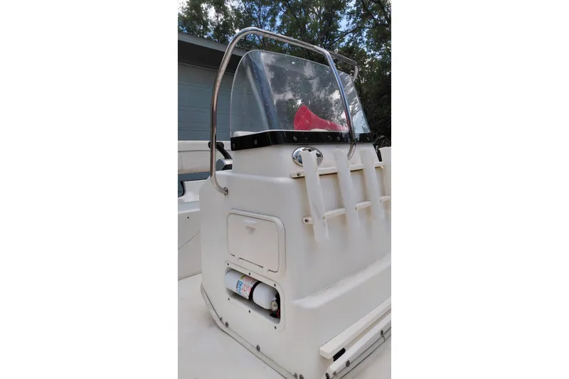 Slide: The Image of 2005 Boston Whaler 170 Montauk boat console with windshield and rod holders. - 8