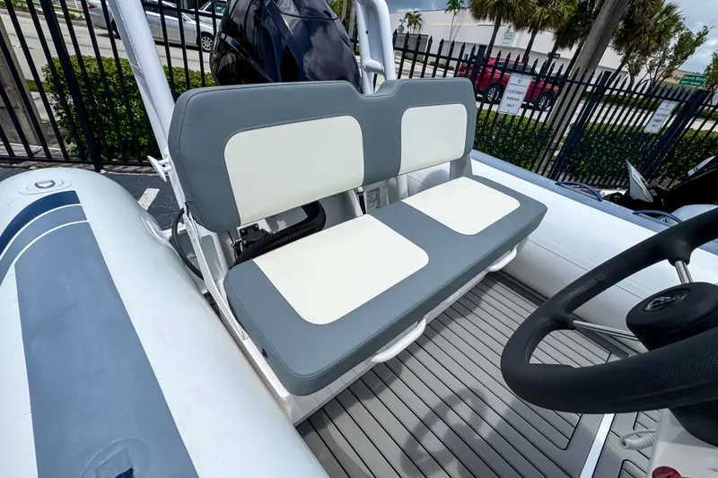 Slide: The Image of 2023 Highfield Classic 420 boat interior with gray and white seating. - 5