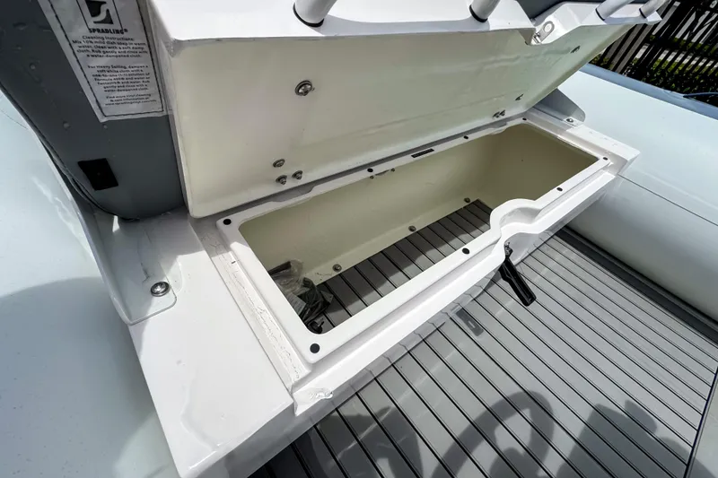 Slide: The Image of Open storage compartment on 2023 Highfield Classic 420 boat, showcasing interior space. - 6