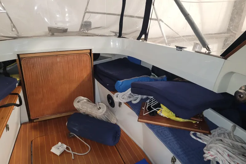 Slide: The Image of Interior of 1986 LM 32 boat with wooden flooring and nautical equipment. - 13