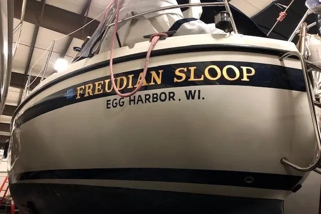 Slide: The Image of 1986 LM 32 sailboat named "Freudian Sloop" docked in Egg Harbor, Wisconsin. - 2