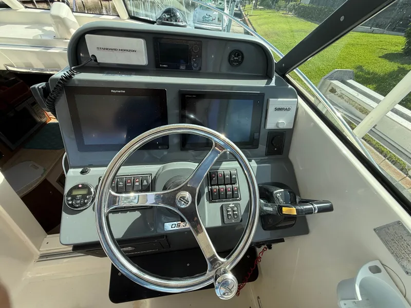 Slide: The Image of Helm console of a 2011 Pursuit 315 OS boat. - 3