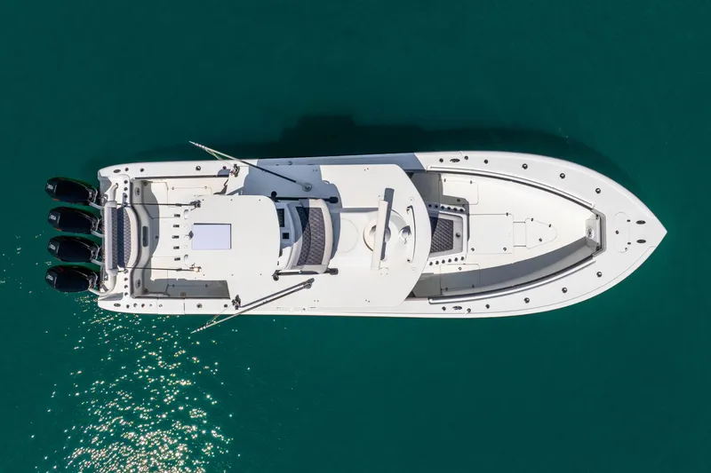 Slide: The Image of Overhead view of 2019 Yellowfin 42 Offshore boat on clear blue water. - 12