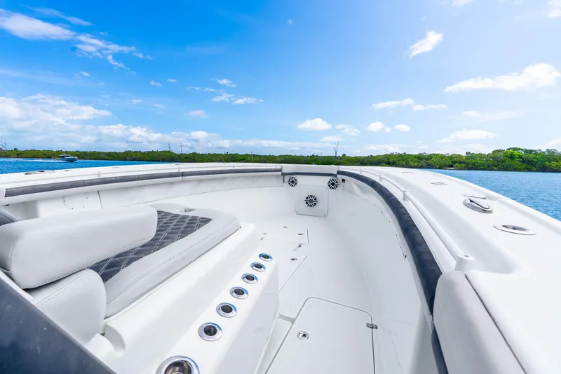 Slide: The Image of 2019 Yellowfin 42 Offshore boat interior with seating, on a sunny day by the water. - 26