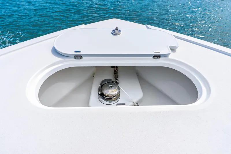 Slide: The Image of 2019 Yellowfin 42 Offshore boat anchor compartment with ocean background. - 27