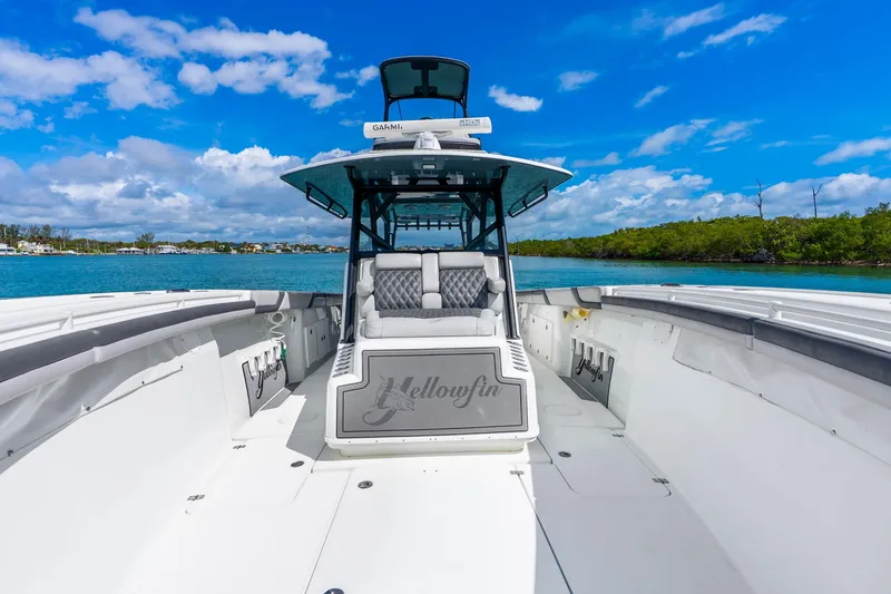Slide: The Image of 2019 Yellowfin 42 Offshore boat on clear blue water, sunny day. - 29