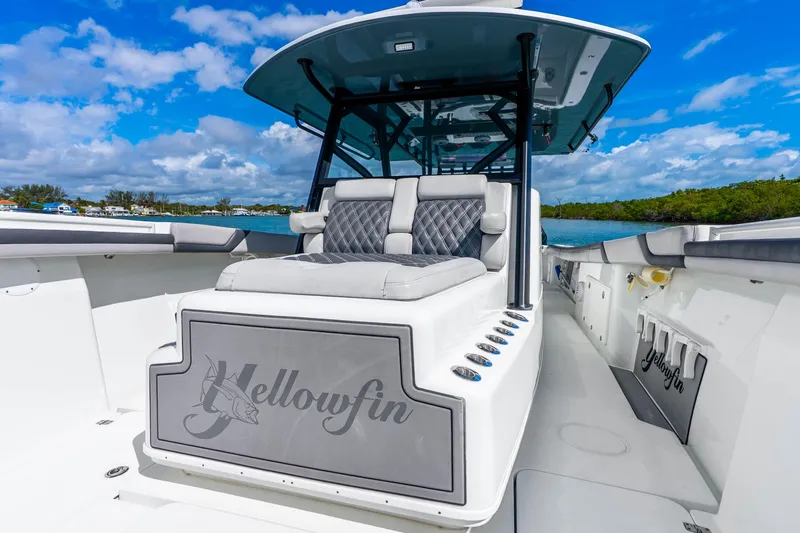 Slide: The Image of 2019 Yellowfin 42 Offshore boat with luxurious seating, sleek design, and scenic ocean backdrop. - 30