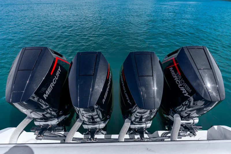 Slide: The Image of Four Mercury outboard engines on a 2019 Yellowfin 42 Offshore boat in clear blue water. - 39