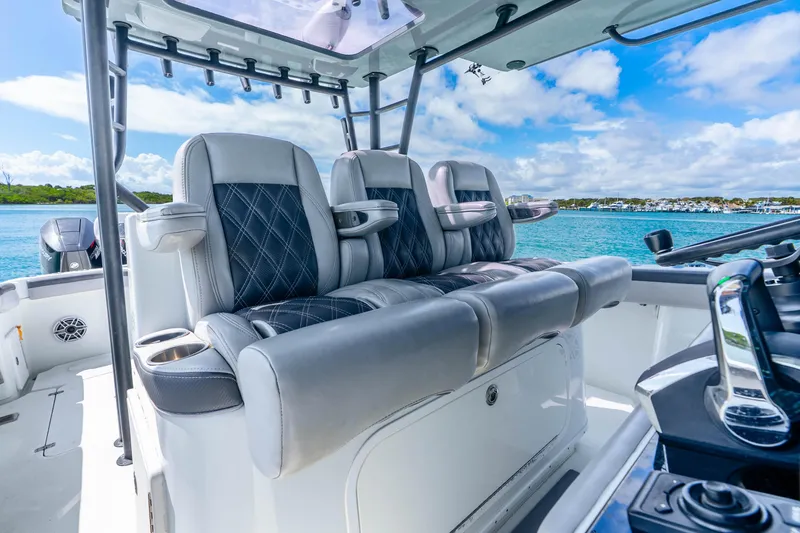 Slide: The Image of 2019 Yellowfin 42 Offshore boat interior with luxurious seating and ocean view. - 43