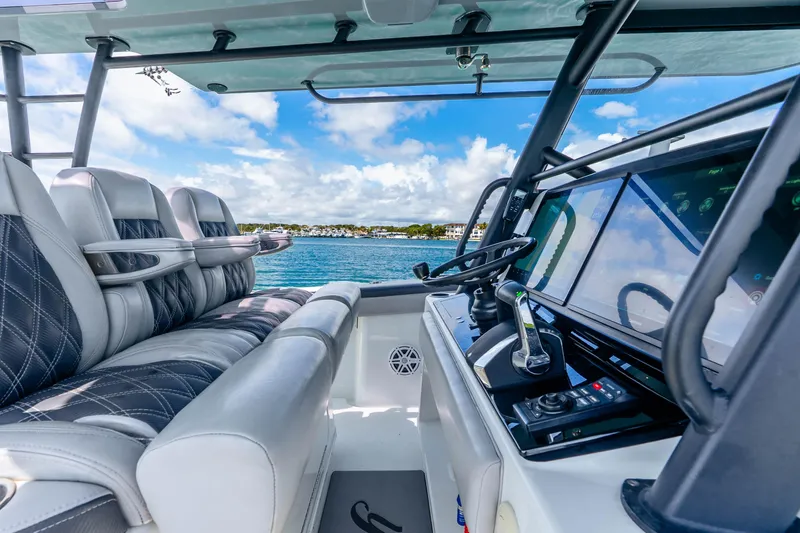 Slide: The Image of 2019 Yellowfin 42 Offshore boat interior with luxurious seating and advanced navigation system. - 44