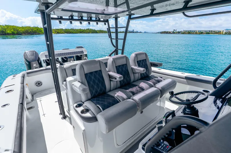 Slide: The Image of 2019 Yellowfin 42 Offshore boat interior with luxurious seating and scenic ocean view. - 46