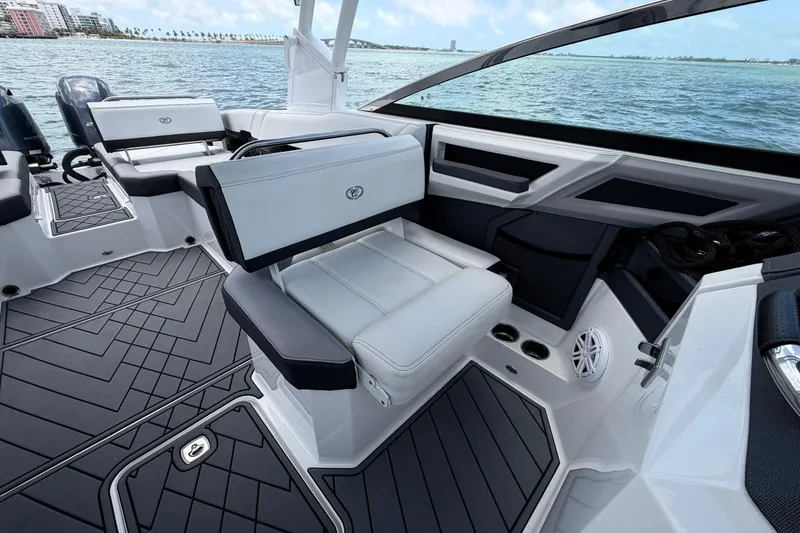 Slide: The Image of 2022 Cobalt R8 Outboard boat interior with luxurious seating and sleek design on the water. - 12