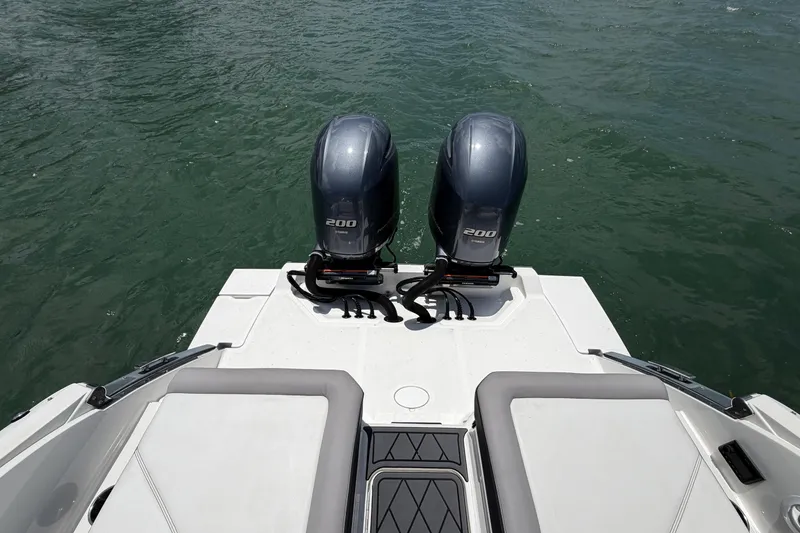 Slide: The Image of 2022 Cobalt R8 Outboard boat with twin 200 horsepower engines on water. - 17
