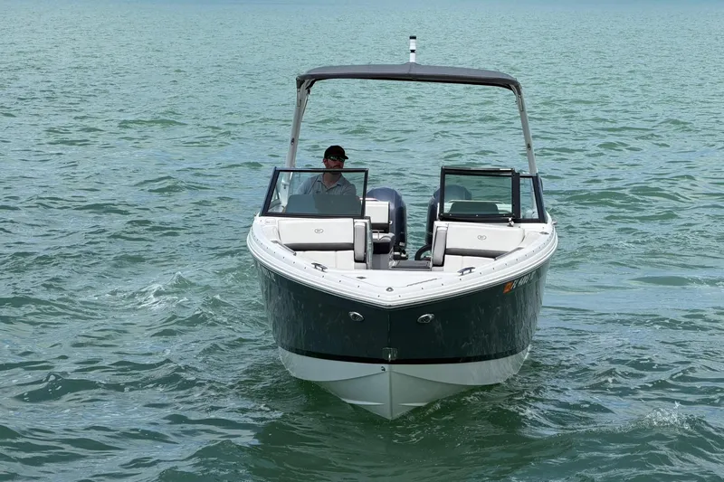 Slide: The Image of 2022 Cobalt R8 Outboard boat cruising on open water. - 2