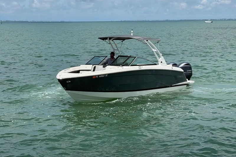 Slide: The Image of 2022 Cobalt R8 Outboard boat cruising on open water under a cloudy sky. - 3
