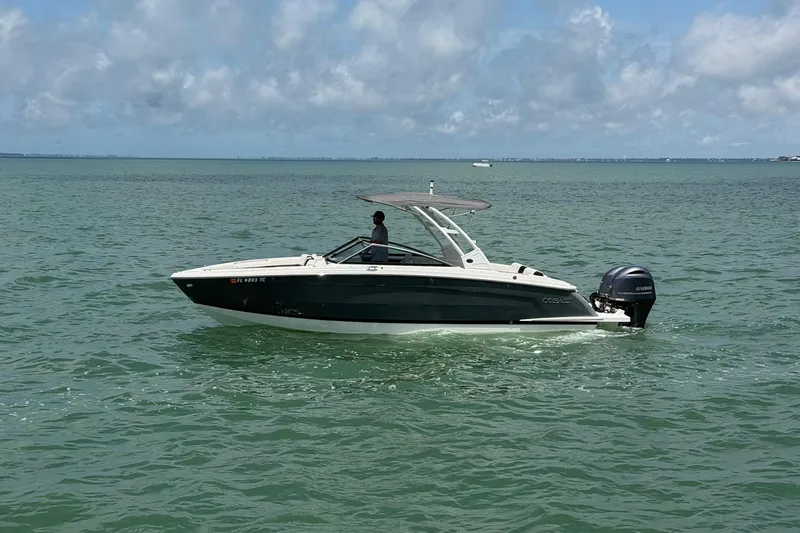 Slide: The Image of 2022 Cobalt R8 Outboard boat cruising on a sunny day in open water. - 4