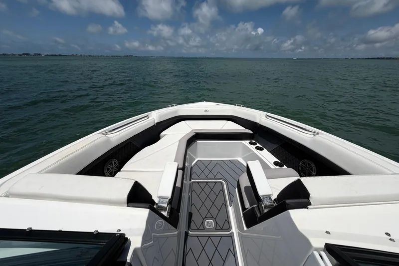 Slide: The Image of 2022 Cobalt R8 Outboard boat interior with spacious seating on open water. - 6