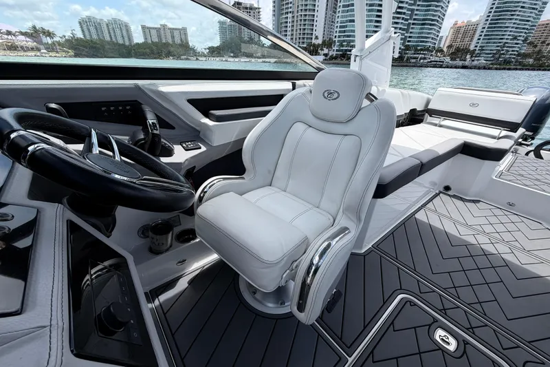 Slide: The Image of 2022 Cobalt R8 Outboard boat interior with luxury seating and modern dashboard. - 9