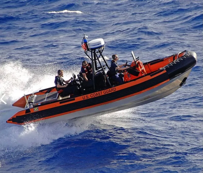 Slide: The Image of U.S. Coast Guard Zodiac 24 boat navigating ocean waves, 2008 model. - 1