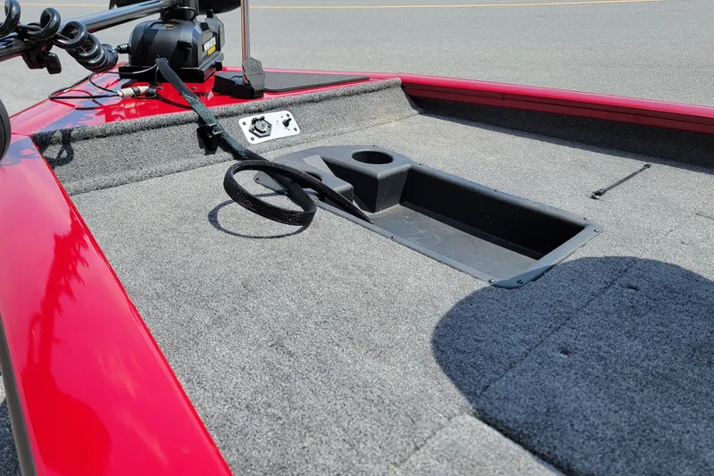Slide: The Image of 2025 Tracker Pro Team 175 boat deck with red trim and fishing rod holder. - 7