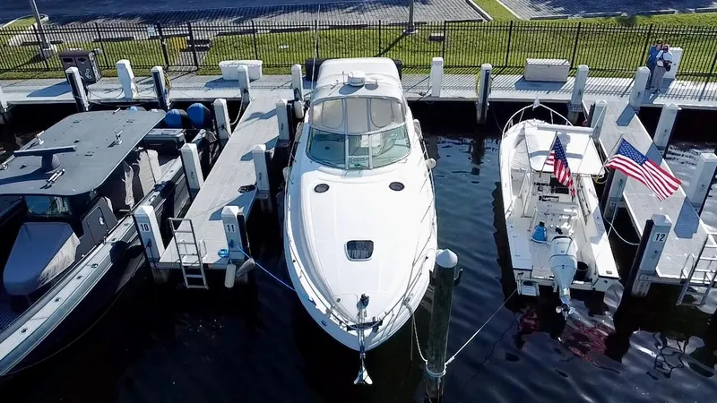 Slide: The Image of Aerial view of a 2006 Sea Ray 340 Sundancer docked at a marina. - 18