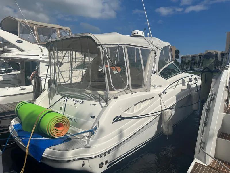 Slide: The Image of 2006 Sea Ray 340 Sundancer docked at marina with clear skies. - 23