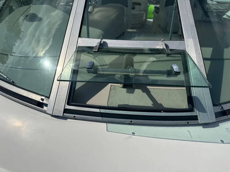 Slide: The Image of Windshield of a 2006 Sea Ray 340 Sundancer boat with an open vent window. - 28