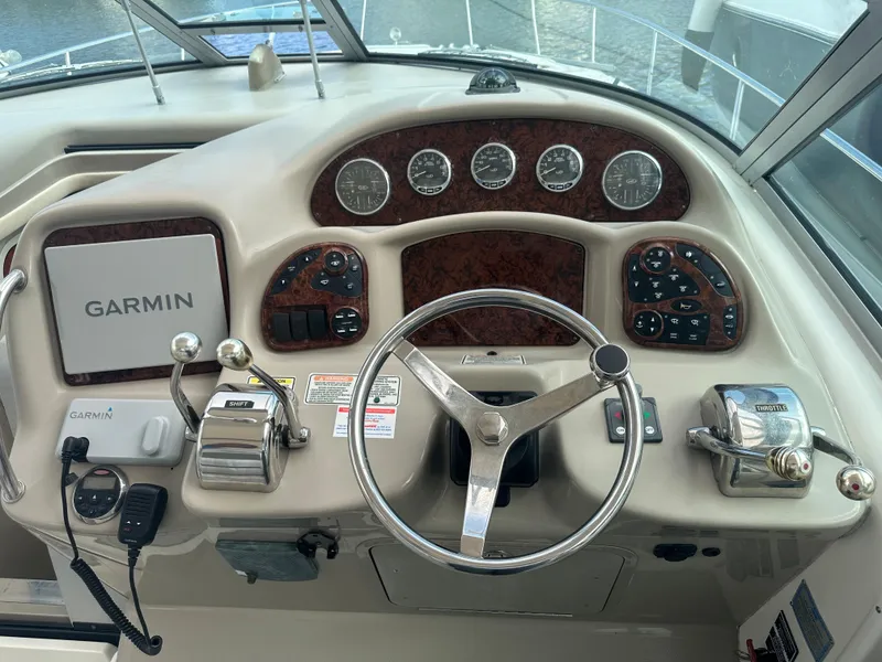 Slide: The Image of 2006 Sea Ray 340 Sundancer helm with Garmin navigation system. - 31