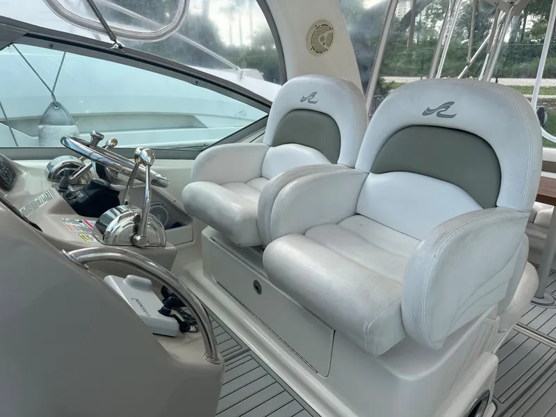 Slide: The Image of 2006 Sea Ray 340 Sundancer helm seats and dashboard. - 32