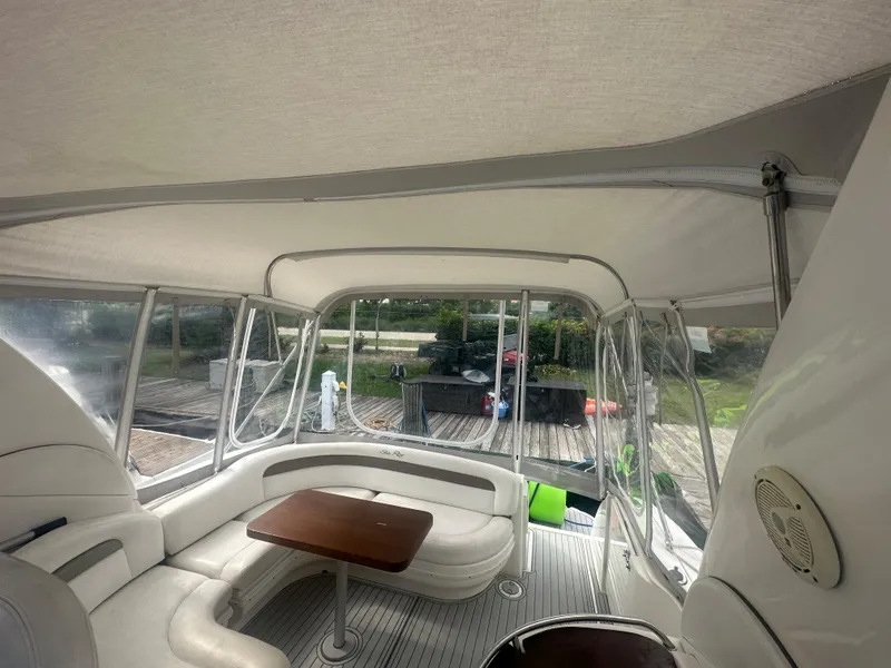 Slide: The Image of Interior of 2006 Sea Ray 340 Sundancer yacht with seating and table. - 35