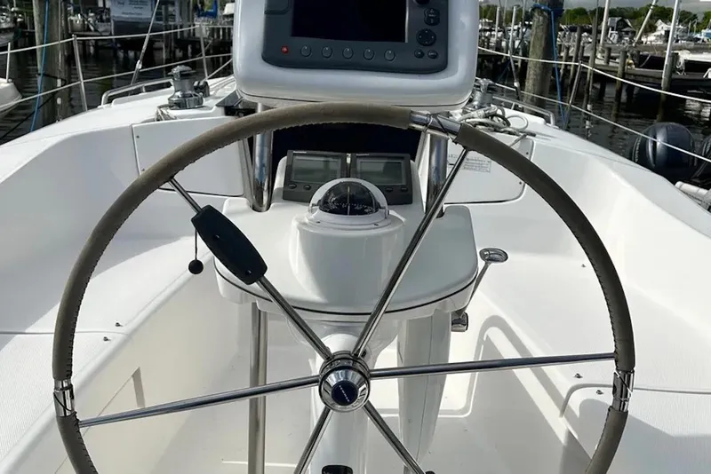 Slide: The Image of Steering wheel and navigation equipment on a 2006 Hunter 36 sailboat. - 3